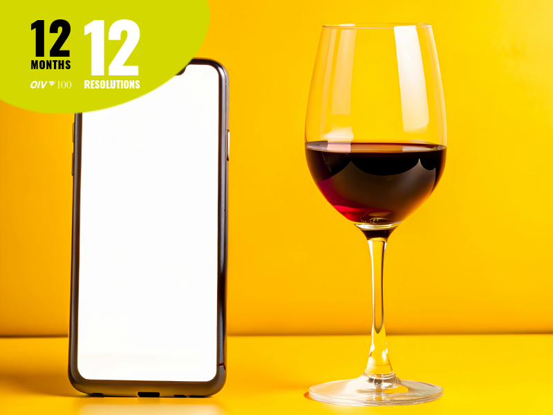 a mobile and a glass of wine
