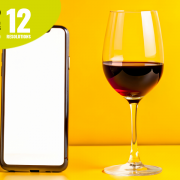 a mobile and a glass of wine